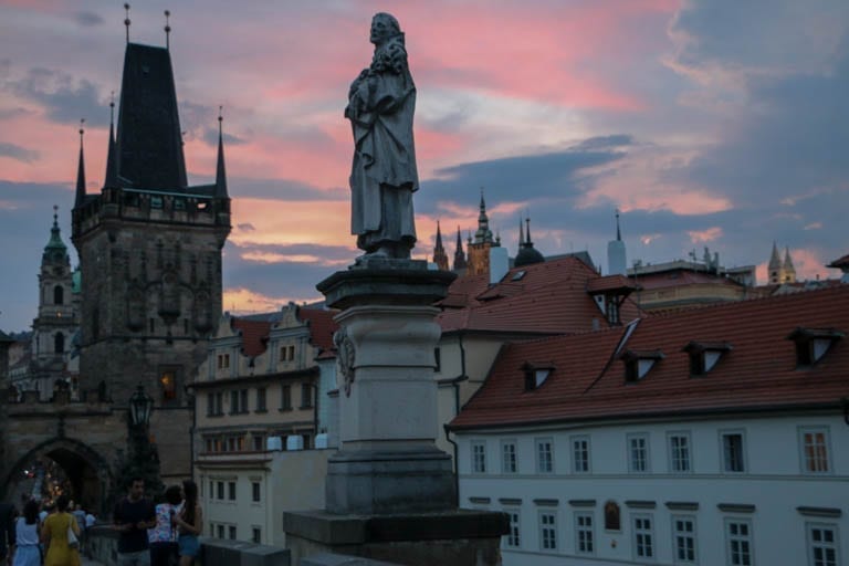 sunset on the charles bridge on a walking tour of prague