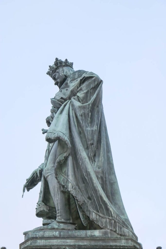 On this walking tour of Prague, you pass beneath the statute of Charles on his namesake bridge. Is King Charles peeing on the tourists?