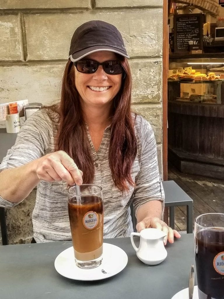 My mom with a coffee in Siena, Italy