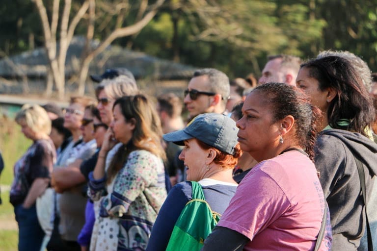 voluteers say goodbye to an elephant at an ethical elephant sanctuary