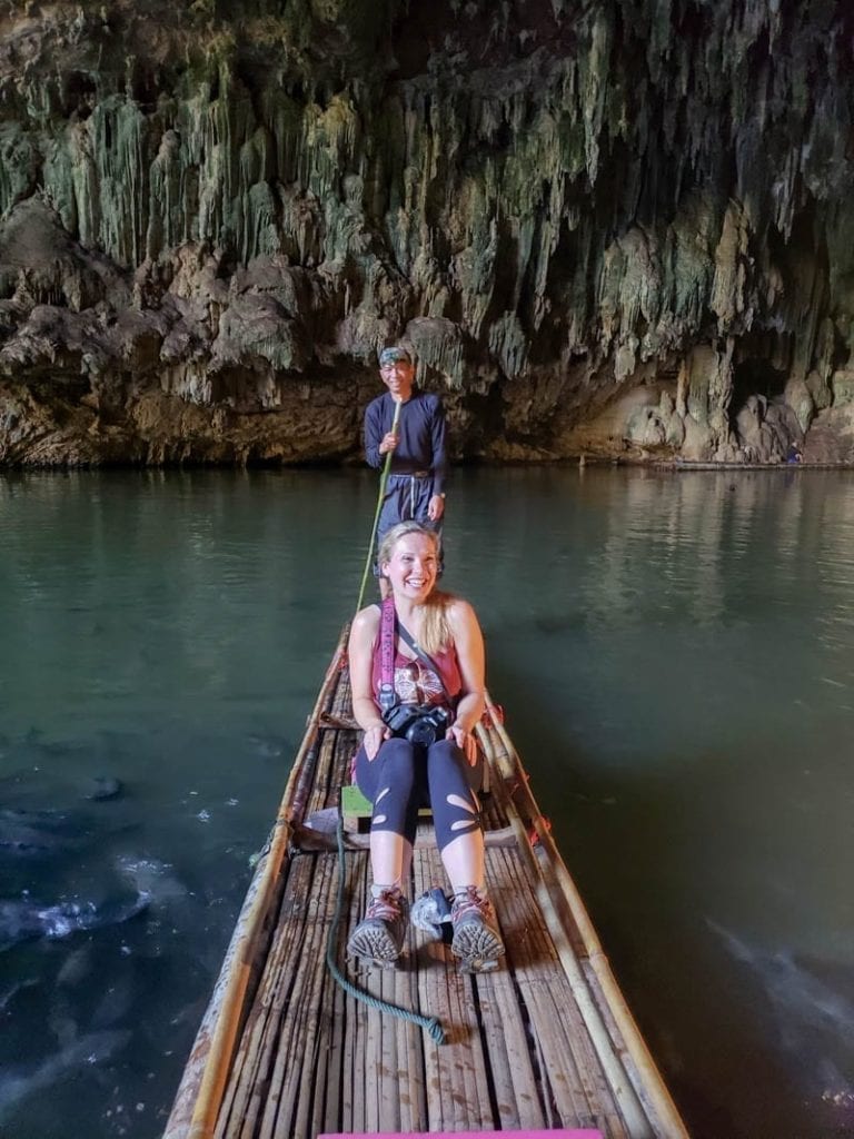 Getting splashed by fish in Thailand's Tham Lot Cave.