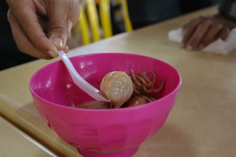 Ketupat sotong is a sweet stuffed squid dessert found in Kuala Lumpur street food stands