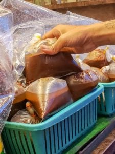 Coconut paste, or pre-made Kerisik, at a Malaysian market