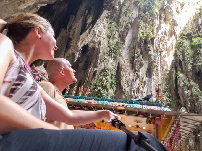 Looking up to the natural skylight of the Batu Caves on your perfect day Kuala Lumpur itinerary