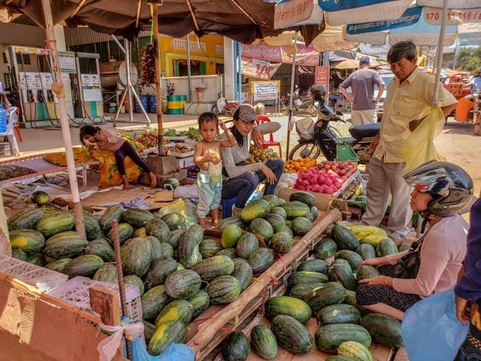 Children standing on stalls in Old Market in Siem Reap