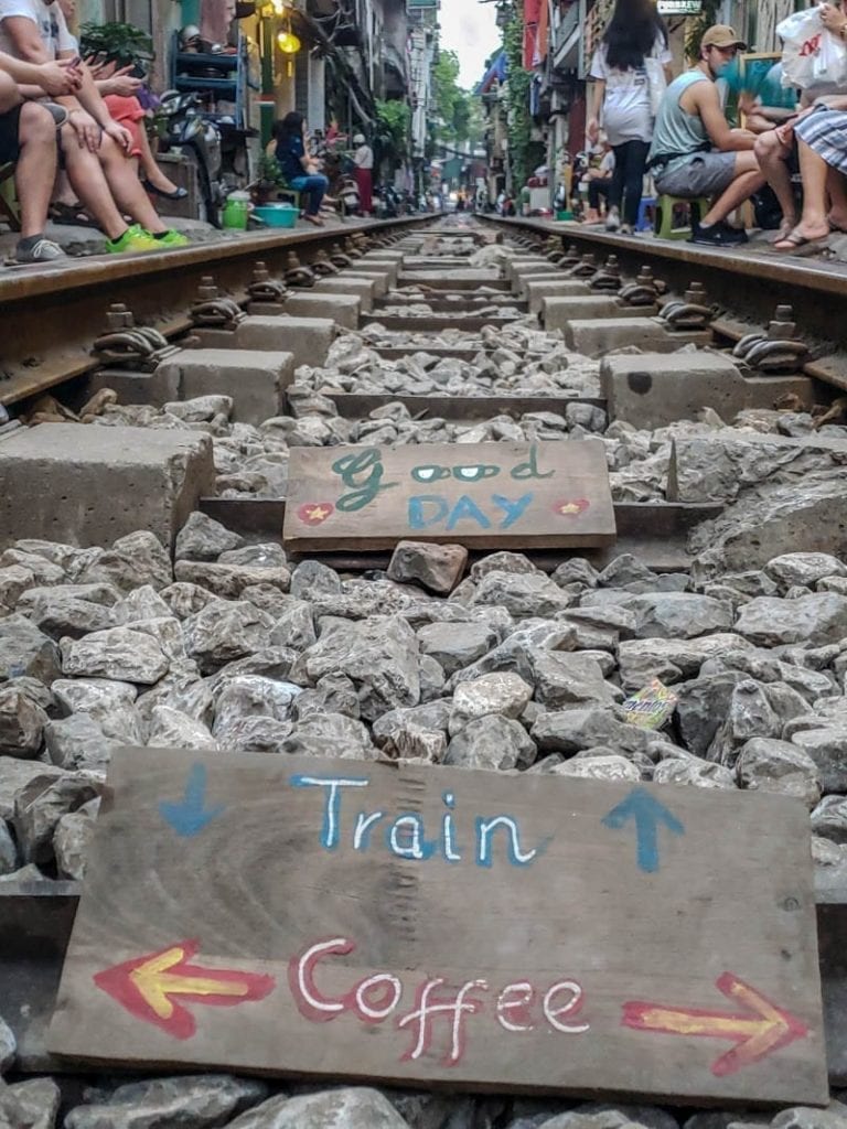 signs on the train tracks on train street in Hanoi