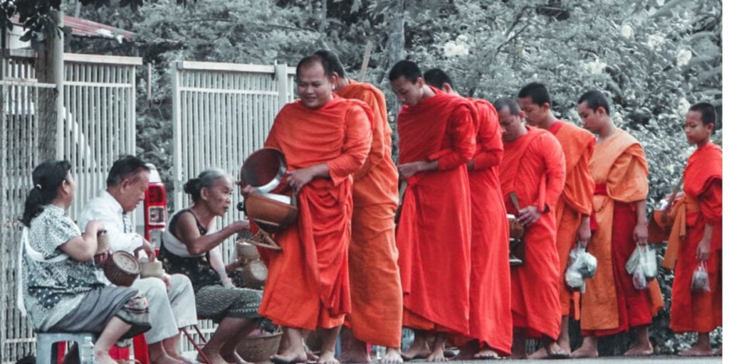 monks collecting alms in luang prabang