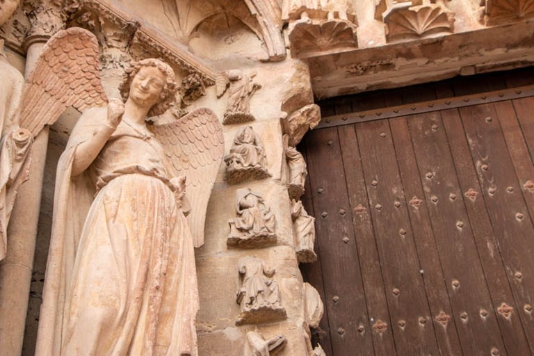 The Smiling Angel of the Reims Cathedral on a day trip to Reims from Paris