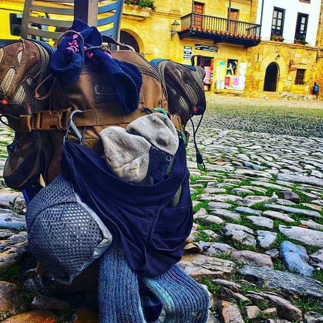 A Backpack with drying laundry dangling. A common site on the Camino del Norte