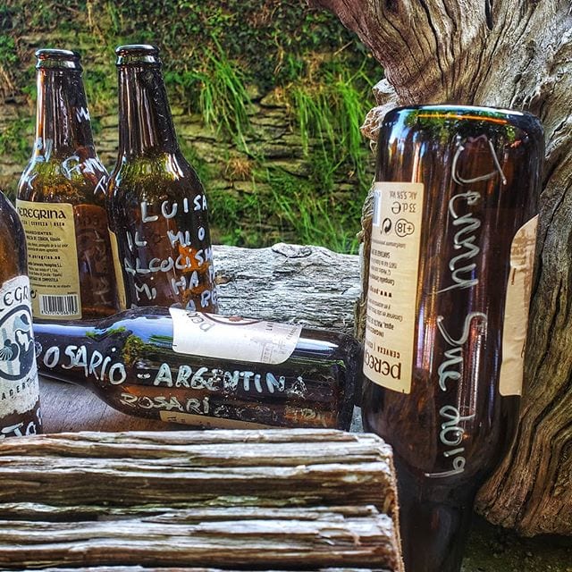 An outdoor pub on the Camino de Santiago where pilgrims sign beer bottles