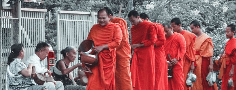 monks giving alms luang prabang