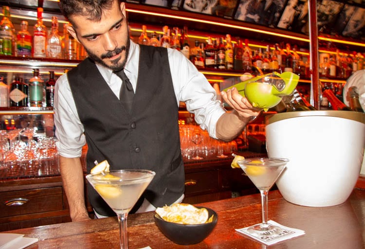 Bartender pours a drink