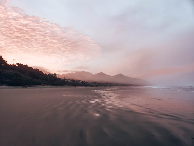 catching a sunrise at cannon beach is a key thing to do on an Oregon Coast road trip