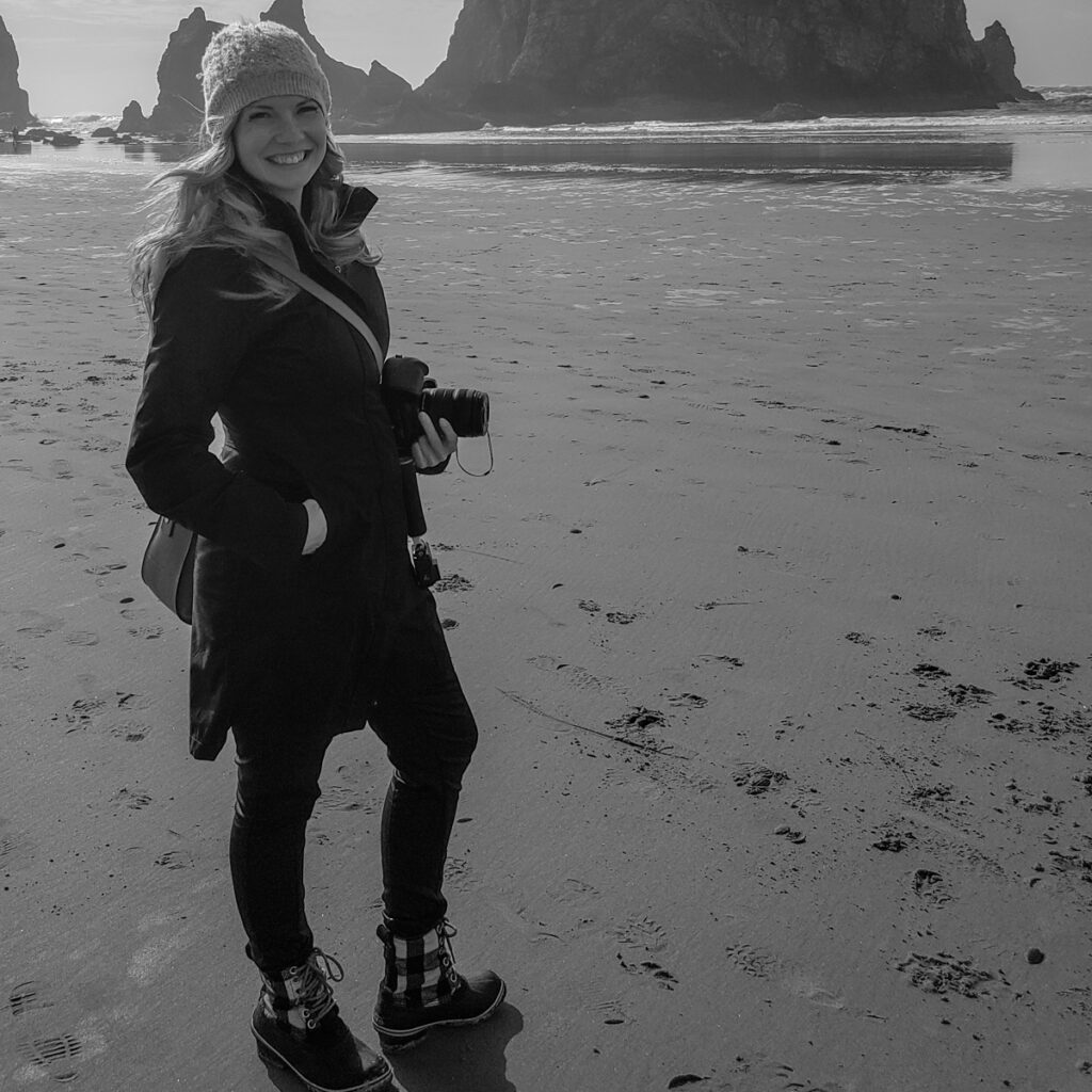 Taking photos at Haystack Rock in Cannon Beach is a must on an Oregon Coast road trip