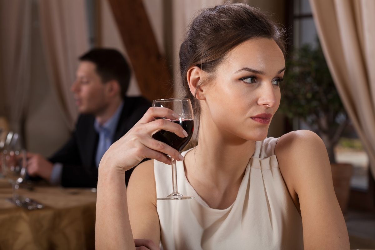 single woman drinking alone