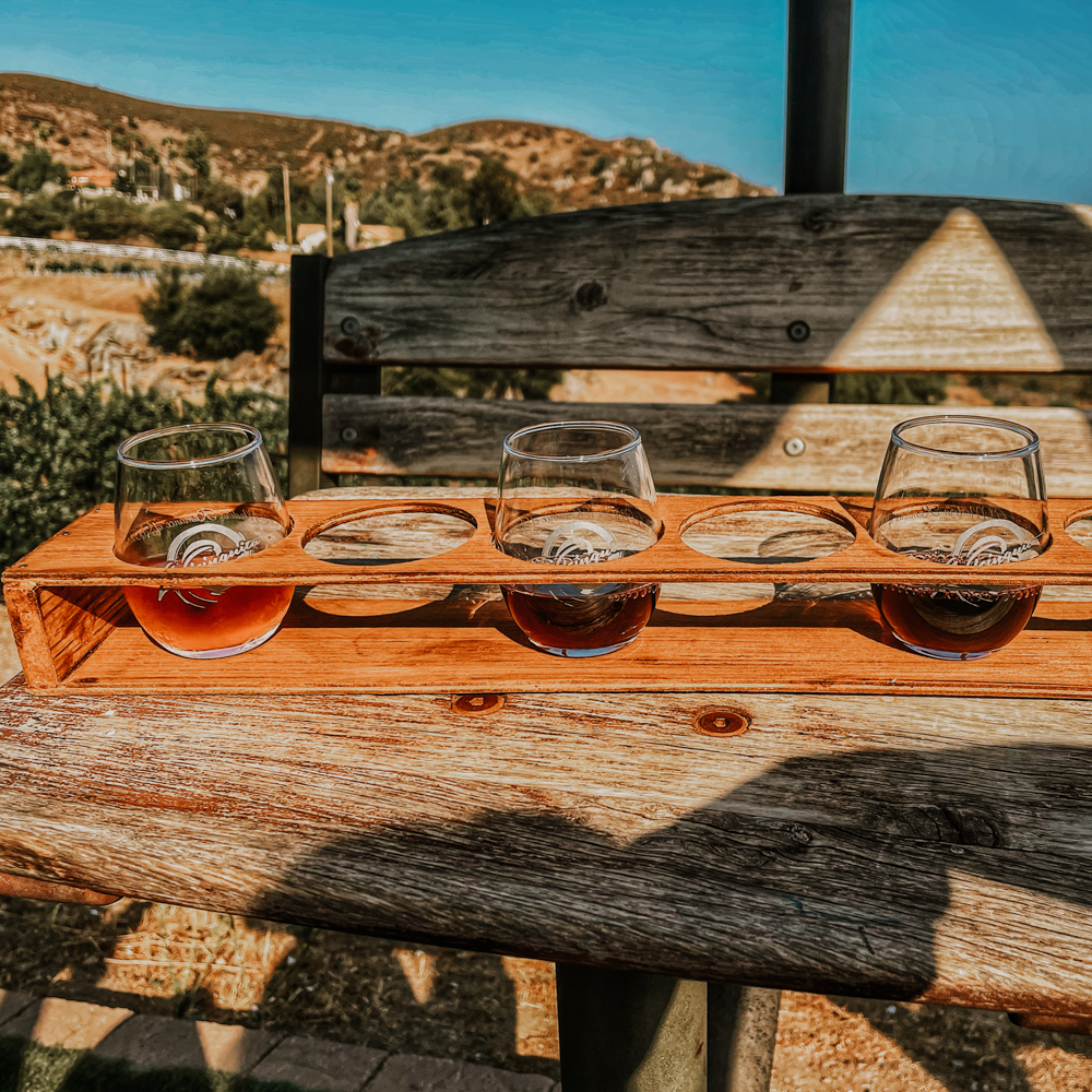 Tasting glasses on the swing at La Finquita, a Romana winery