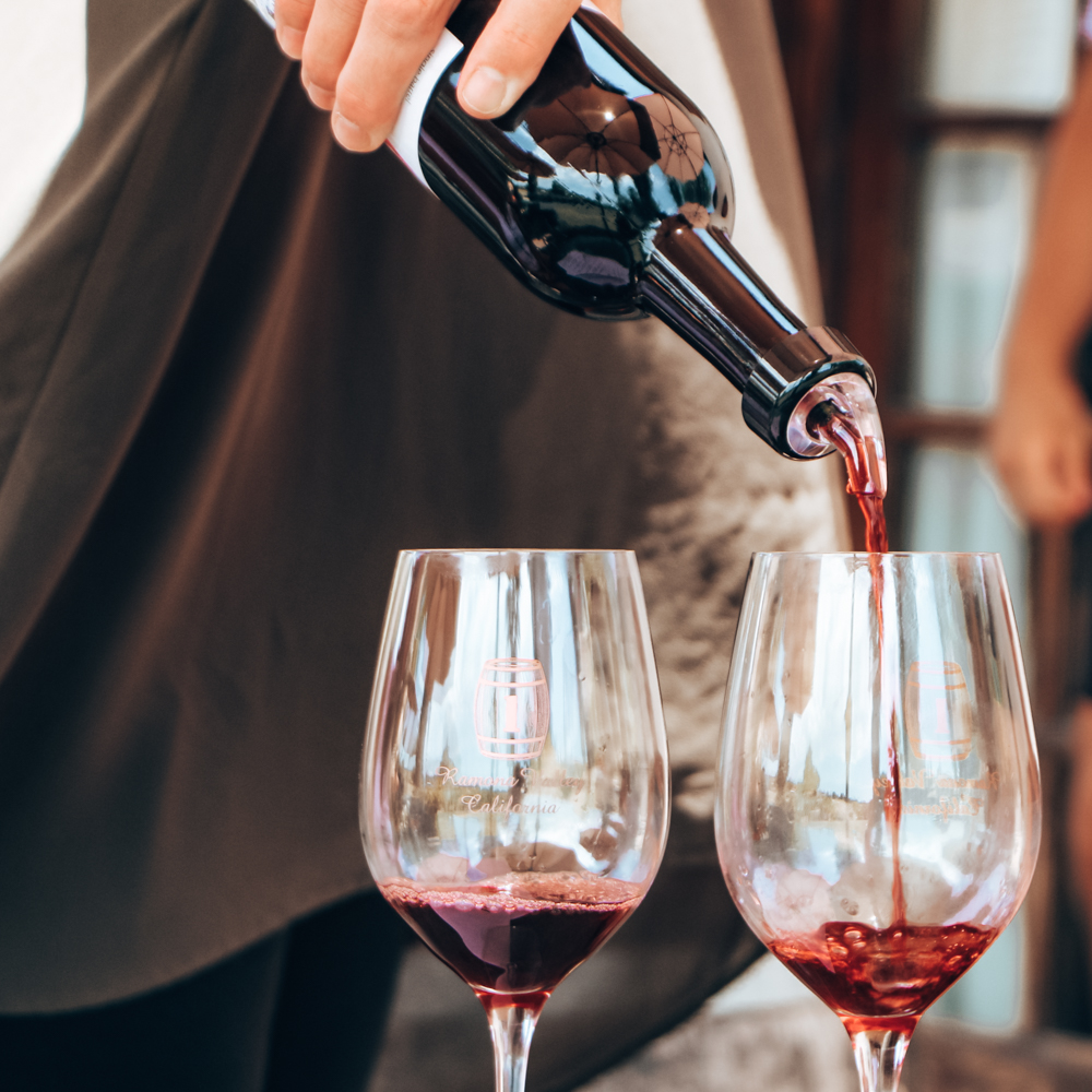 Pouring wine at a Romana winery