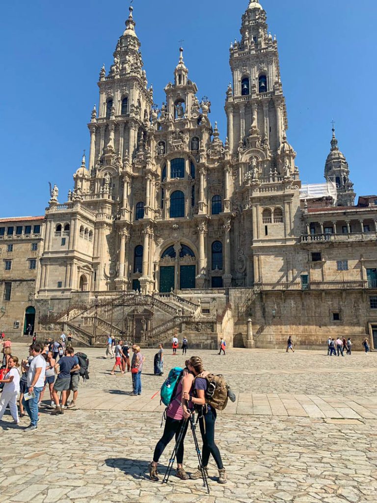 Two pilgrims finish the Camino de Santiago